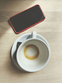 High angle view of coffee cup on table