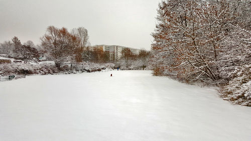 Snow covered landscape against sky