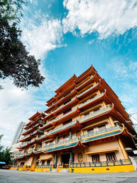Low angle view of pagoda against building