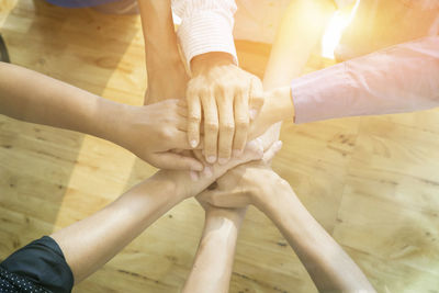 High angle view of people with hands