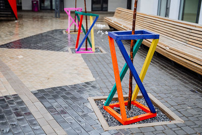 High angle view of chairs and table on sidewalk