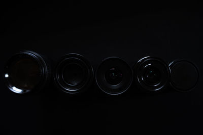 High angle view of empty bottles against black background