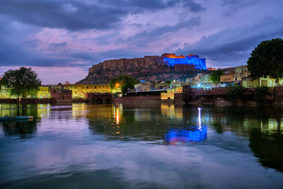 Illuminated buildings in water