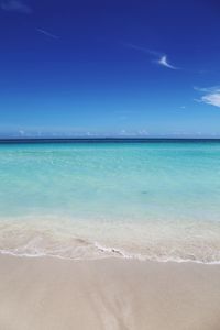 View of beach against blue sky