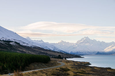 Scenic view of mountains and lake against sky