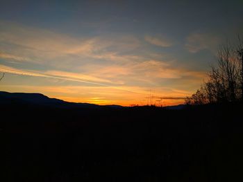 Scenic view of silhouette landscape against sky during sunset