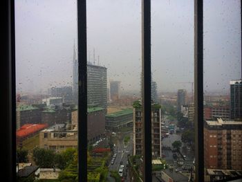 View of cityscape through window