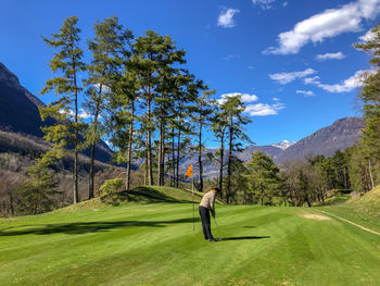 Full length of man standing on golf course