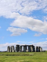 Built structure on landscape against sky