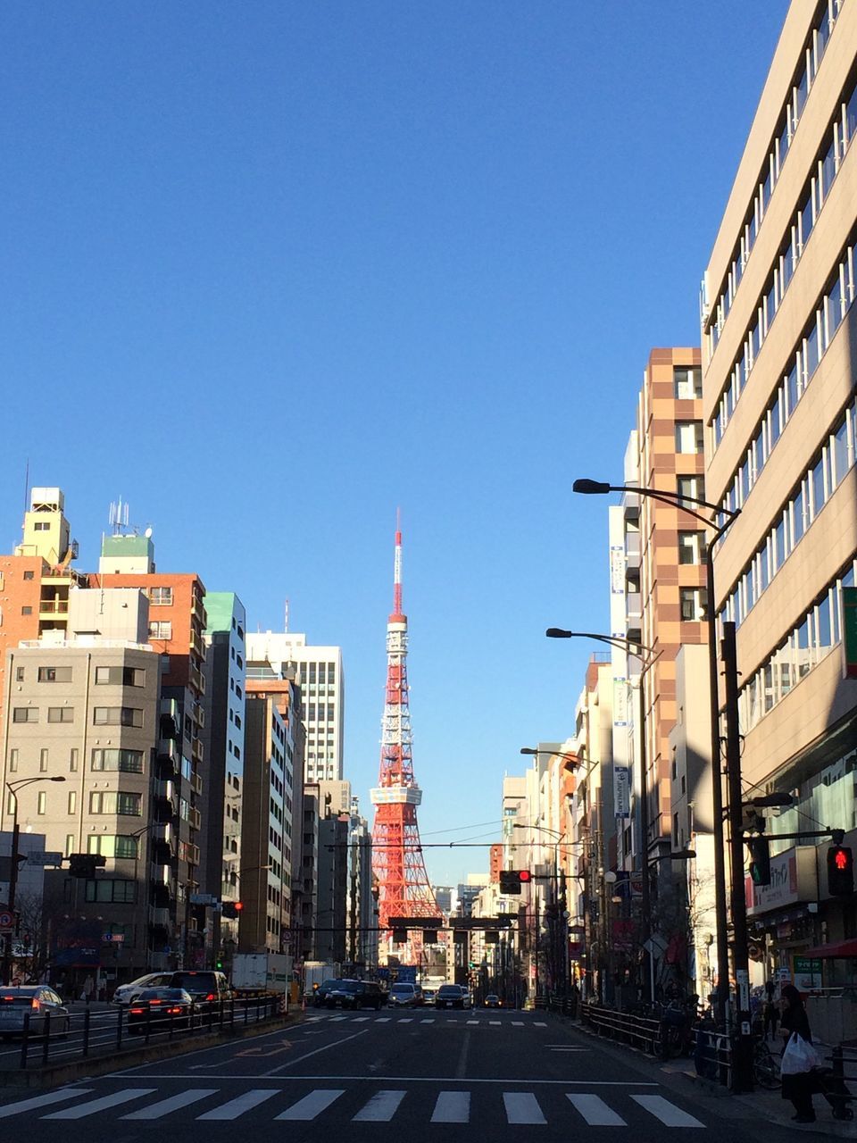 building exterior, city, clear sky, architecture, road, outdoors, transportation, day, travel destinations, built structure, no people, skyscraper, sky