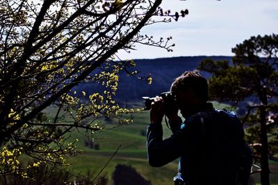 Man photographing with camera