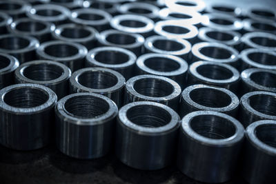 A large number of manufactured threaded metal parts