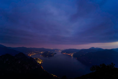 Scenic view of silhouette mountains against sky at sunset