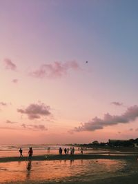 Scenic view of beach against sky during sunset