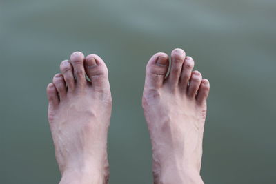Close-up of human hand against blurred background