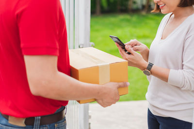 Side view of woman using mobile phone