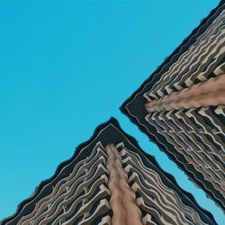 Low angle view of building against blue sky