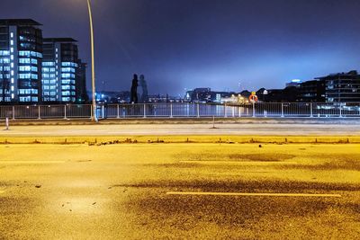 View of illuminated city buildings at night