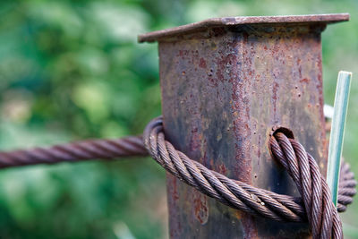 Close-up of rope tied on wooden post