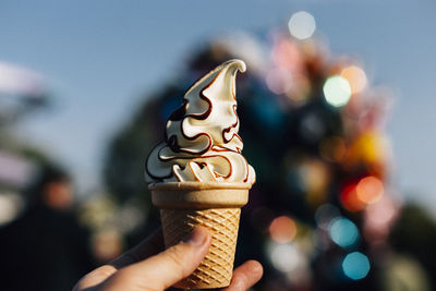 Close-up of hand holding ice cream