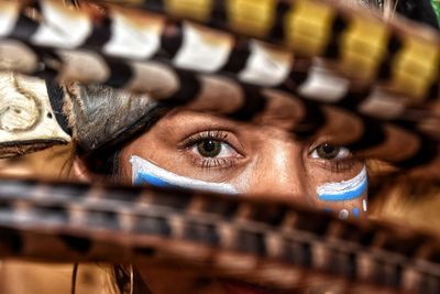 Close-up portrait of woman with painted face