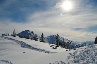 Scenic view of snow mountains against sky