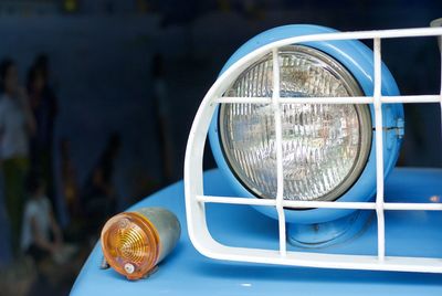 Cropped image of blue vintage car with headlight