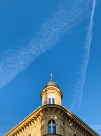 Low angle view of building against blue sky