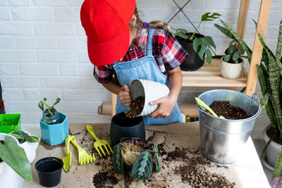 High angle view of man working in greenhouse