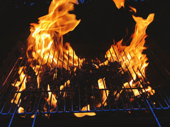 Close-up of bonfire against fire at night