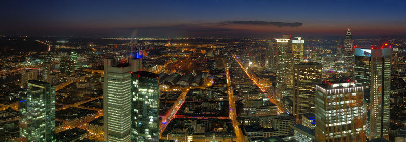 High angle view of illuminated city buildings at night