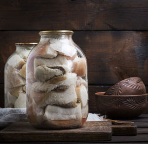 Breads in jar on cutting board