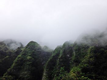 Scenic view of mountains in foggy weather