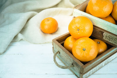 High angle view of oranges on cutting board