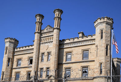 Low angle view of historical building against blue sky