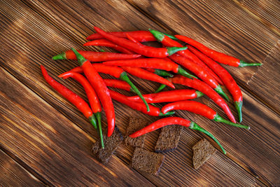 Close-up of red chili peppers on table