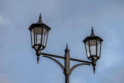 Low angle view of street light against sky