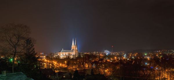 Illuminated buildings in city at night