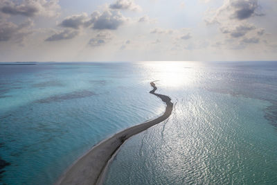 Maldives, lhaviyani atoll, aerial view of sandbar surrounded by waters of indian ocean