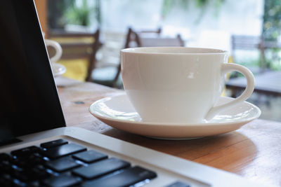 Close-up of coffee cup on table