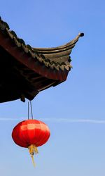 Low angle view of traditional building against clear blue sky