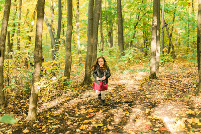 Full length of man standing in forest