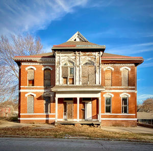 Facade of historic building against sky