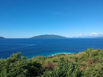 Scenic view of sea against clear blue sky