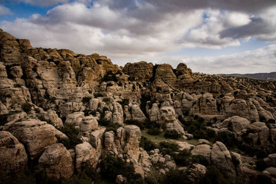 Low angle view of rocks against sky