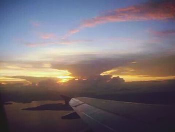 Scenic view of landscape against sky at sunset