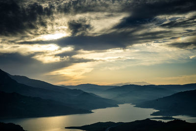 Scenic view of mountains against dramatic sky