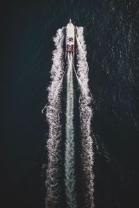 Aerial view of motorboat sailing on sea