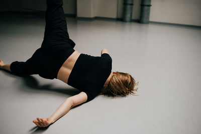 Midsection of woman with arms raised