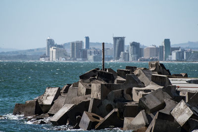 Buildings in city against clear sky